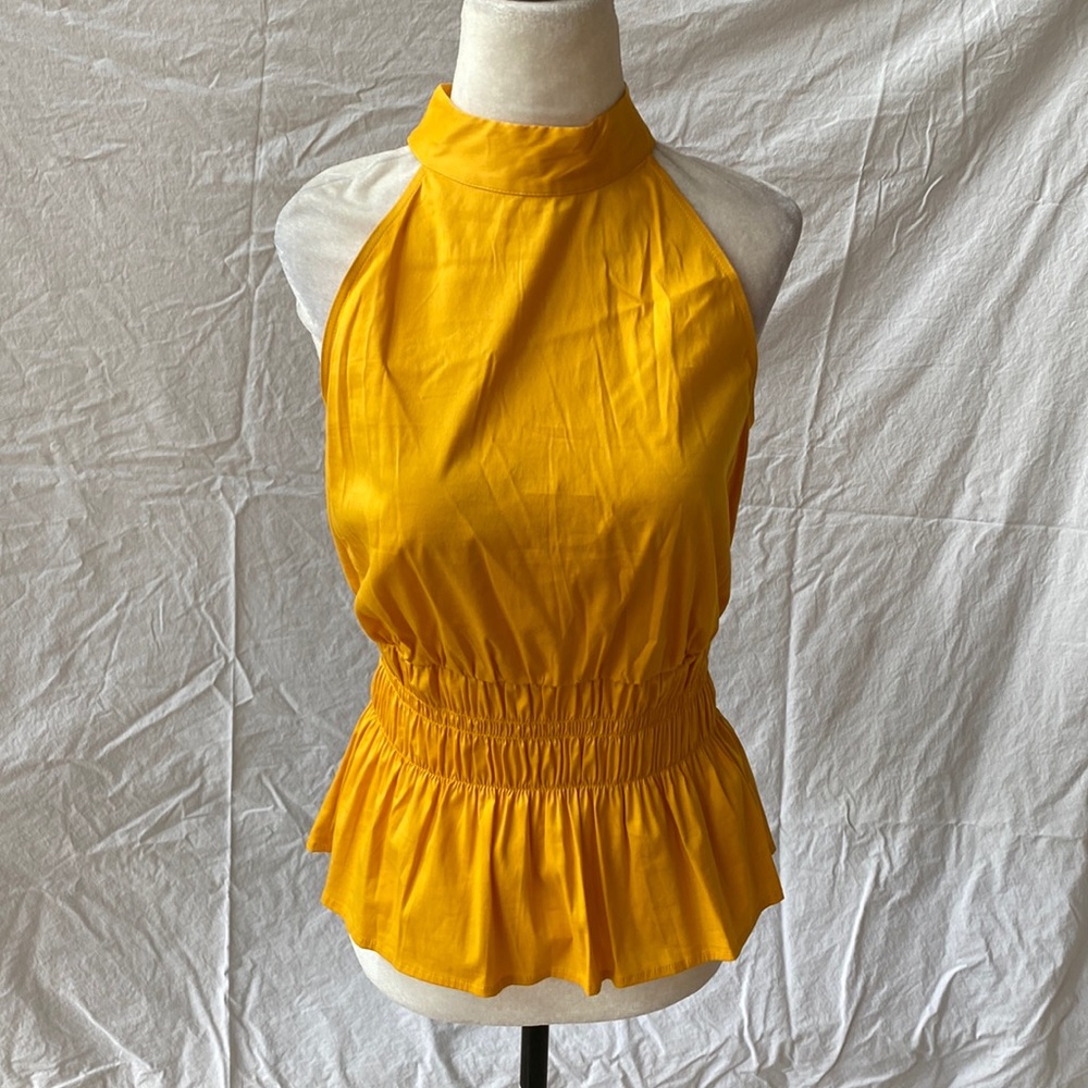 White House Black market beautiful gold colored halter top.